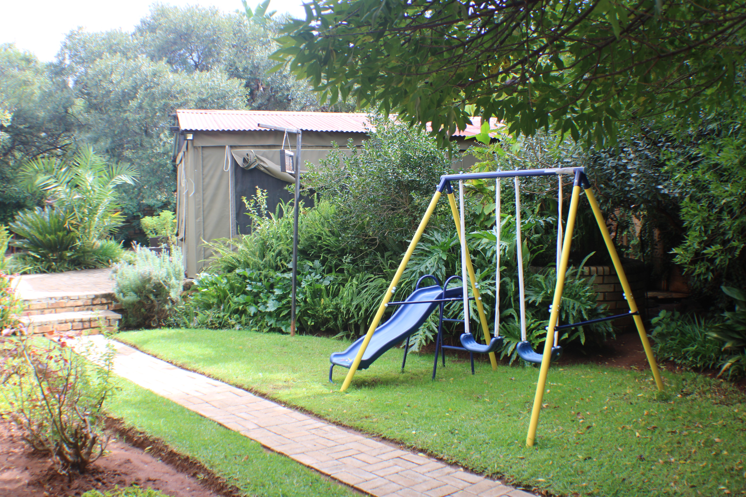 Ukarimu Guesthouse gardens with children's play area